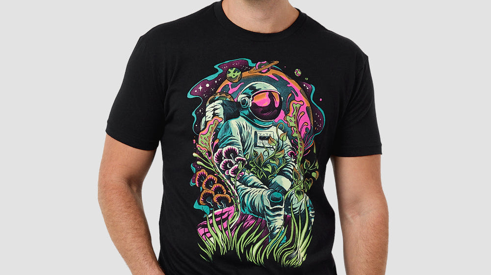 Man wearing the INTO THE AM Galactic Jungle graphic tee